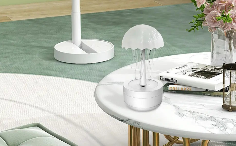 white jellyfish-shaped humidifier table lamp with translucent glowing tentacles and a sleek cylindrical base featuring 7 color led essential oil diffuser functionality