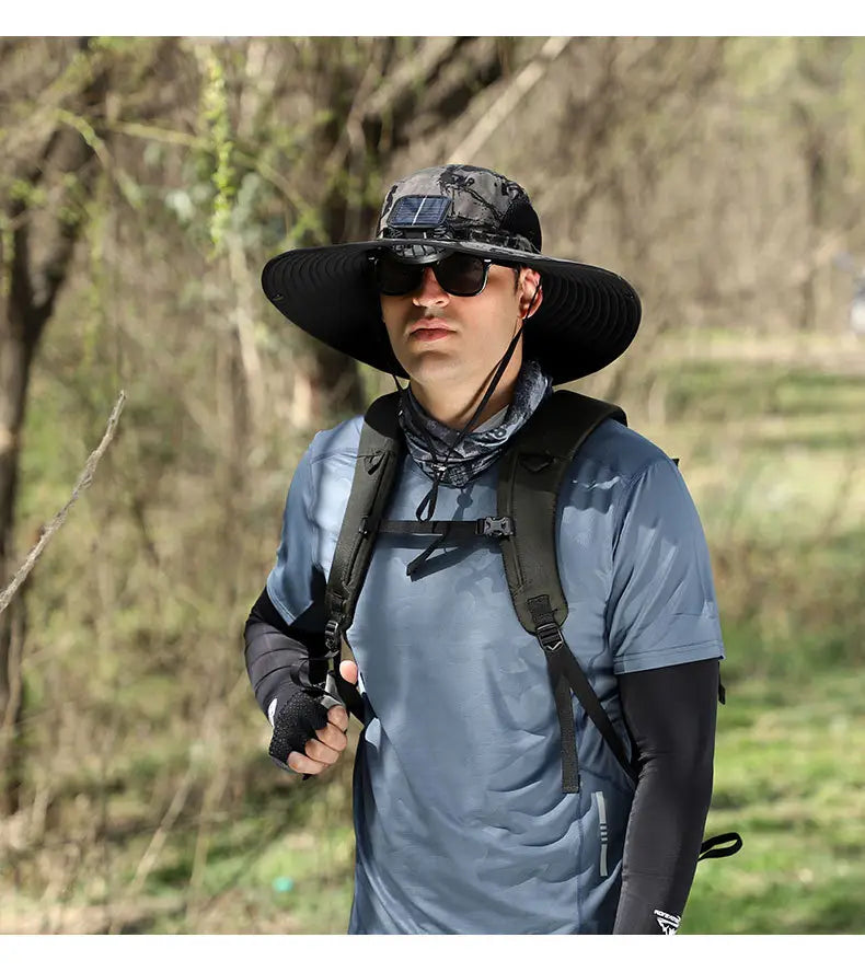 Black wide-brimmed sun hat with a solar panel on the crown designed as a camouflage solar fan bucket hat for outdoor sun protection.