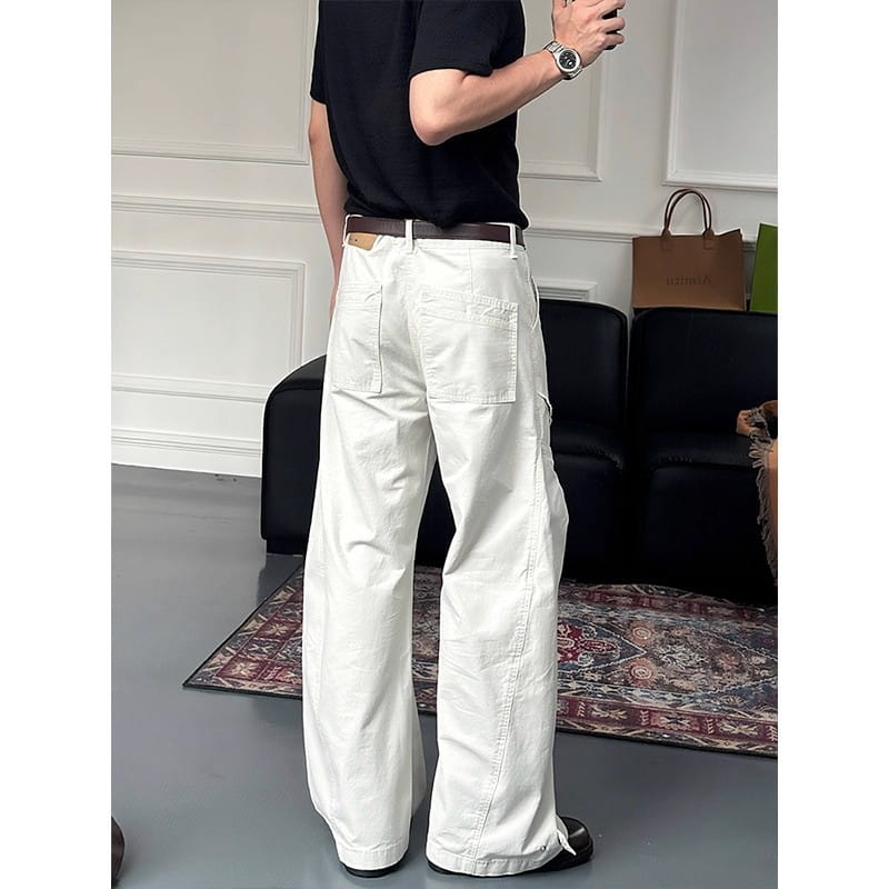 white wide-leg cargo pants with a relaxed cut featuring multiple pockets for versatile wear
