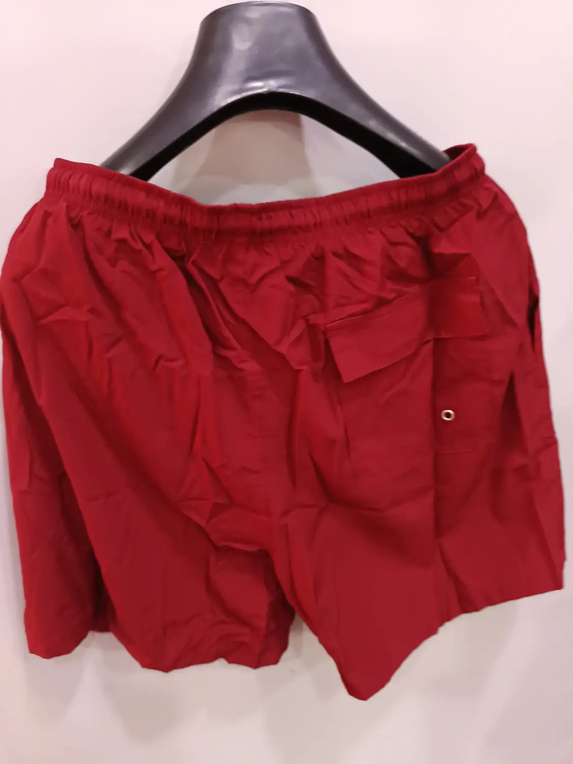 Red printed men beach shorts summer swim trunks with elastic waistband and a single side pocket.