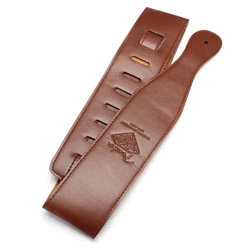 Brown leather guitar strap with suede lining adjustable from 110 to 130 cm featuring an embossed logo and multiple adjustment holes.