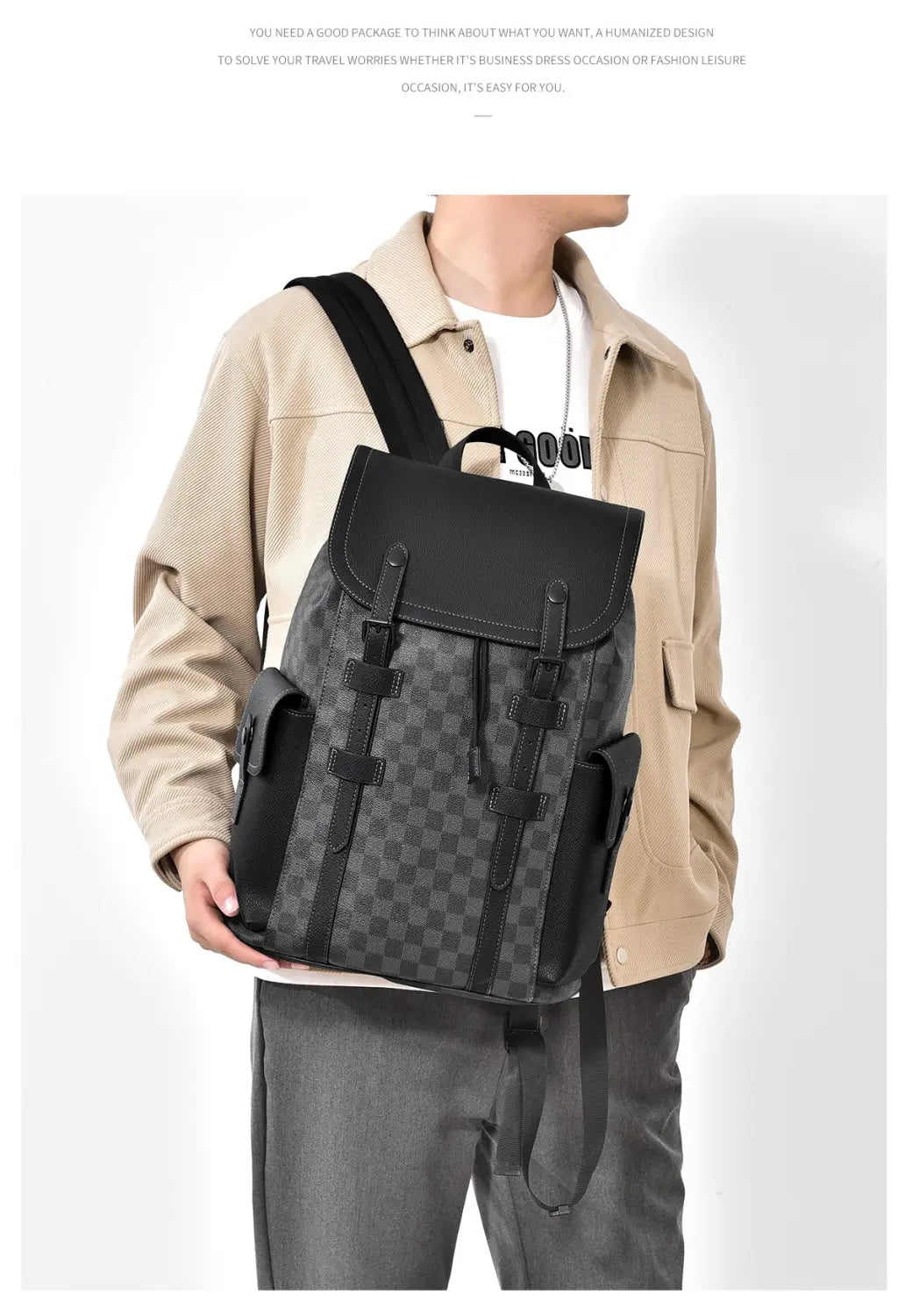 Men’s leather business travel backpack in black and gray checkered fabric with black leather straps and front flap featuring a laptop sleeve.