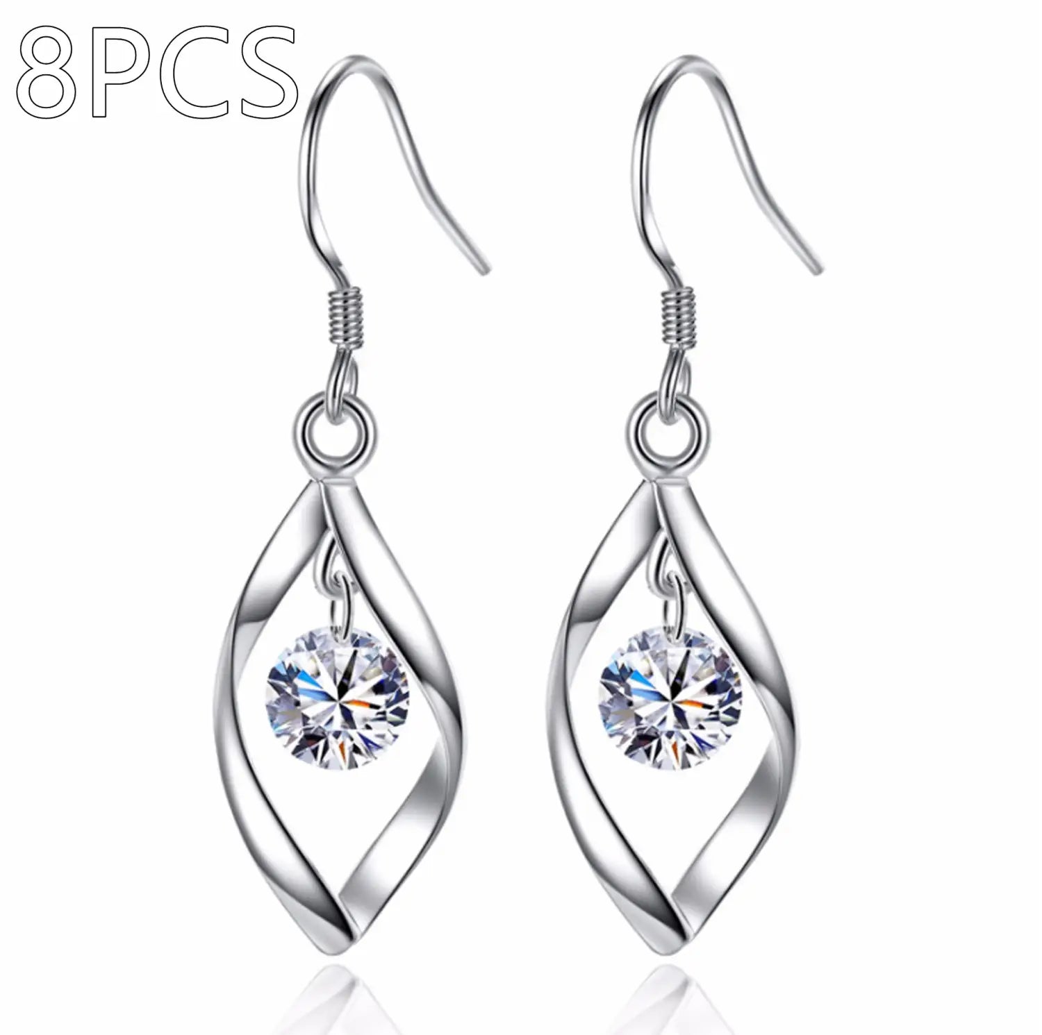 Twisted teardrop silver earrings featuring a twisted wire design with a central round faceted crystal.