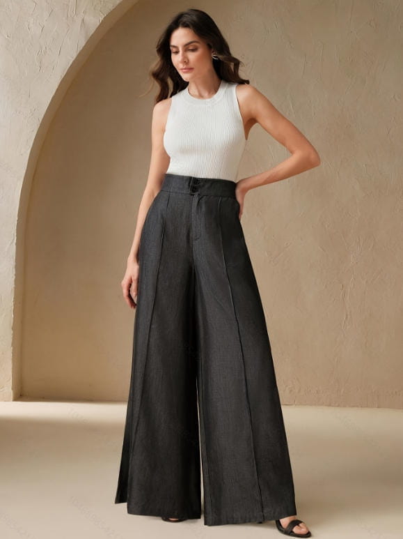 Black high waisted wide leg trousers with a structured pleated design and front button closure.