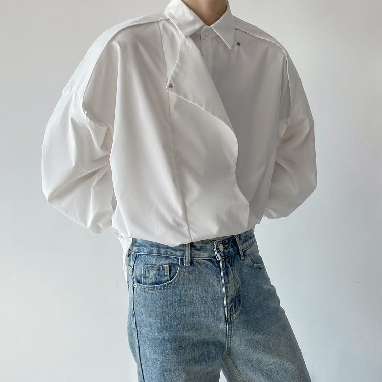 Men oversized long sleeve button up shirt in white with voluminous sleeves and a modern asymmetrical design.