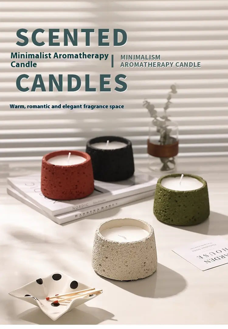 Supports de bougie en ciment parfumé à esthétique minimaliste, finition en béton texturé à effet moucheté, disponibles en rouge, noir, vert olive et beige.