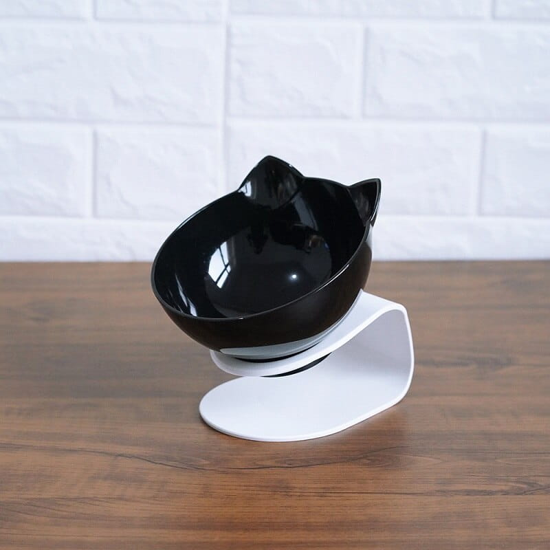 Black cat-shaped bowl with glossy finish mounted on a white adjustable stand in an elevated cat bowl tilted 15 degree double feeder stand.