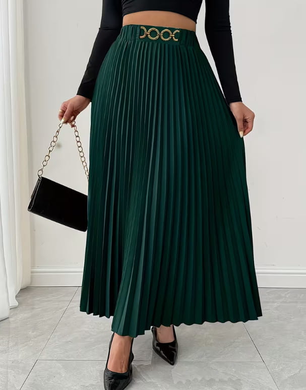 Deep green pleated midi skirt with a high-waisted a-line silhouette and a decorative gold-toned belt buckle featuring an intricate circular design.
