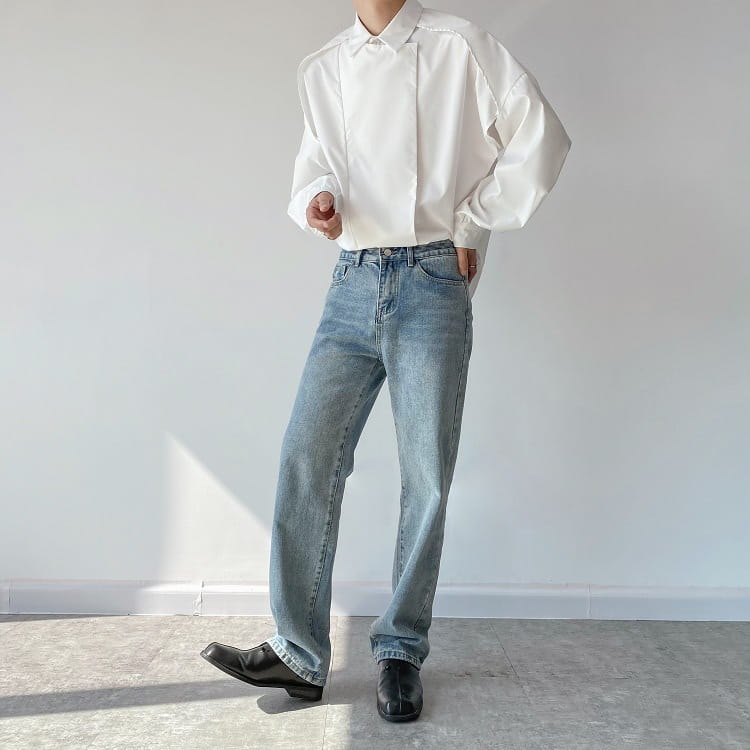 light-wash denim jeans with a straight-leg cut and classic five-pocket design paired with a men oversized long sleeve button up shirt