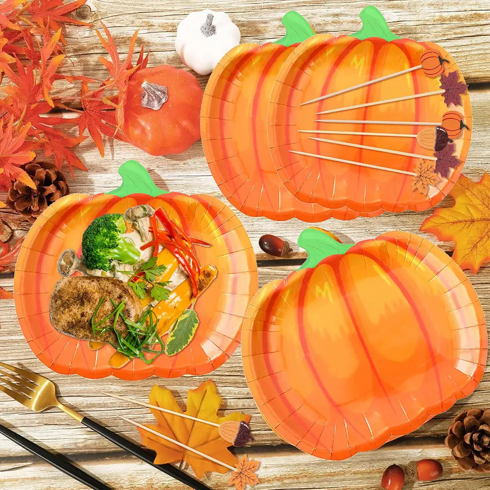 thanksgiving pumpkin paper plates are orange pumpkin-shaped paper plates with green stems and subtle vertical ridges featuring decorative autumn leaf and acorn motifs.