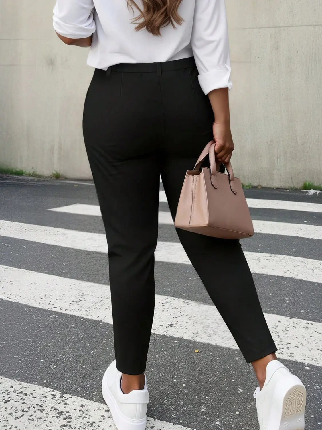 Black high waist straight leg trousers plus size with a sleek tailored cut and subtle creasing at the waistband.