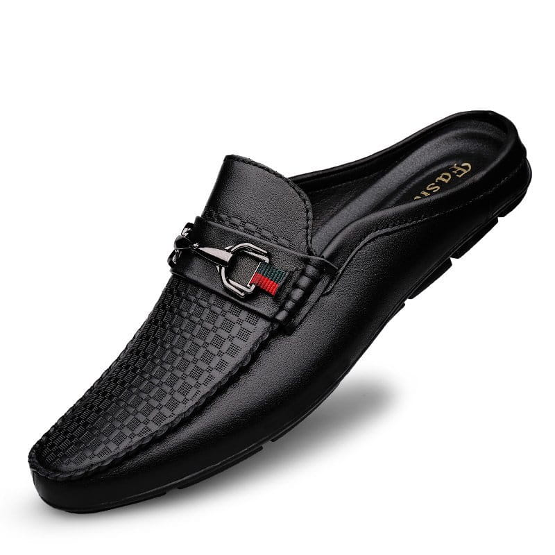 Men’s black leather mule loafers with a textured pattern and a silver buckle accent featuring red and green stripes.