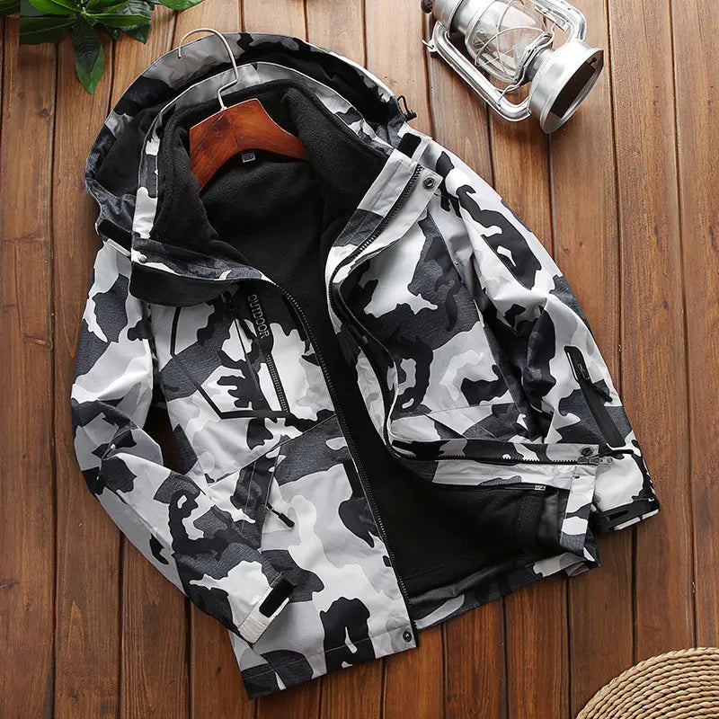 men three-in-one waterproof winter sportswear jacket featuring a black and white camouflage pattern, hood, front zipper closure, and black inner lining.