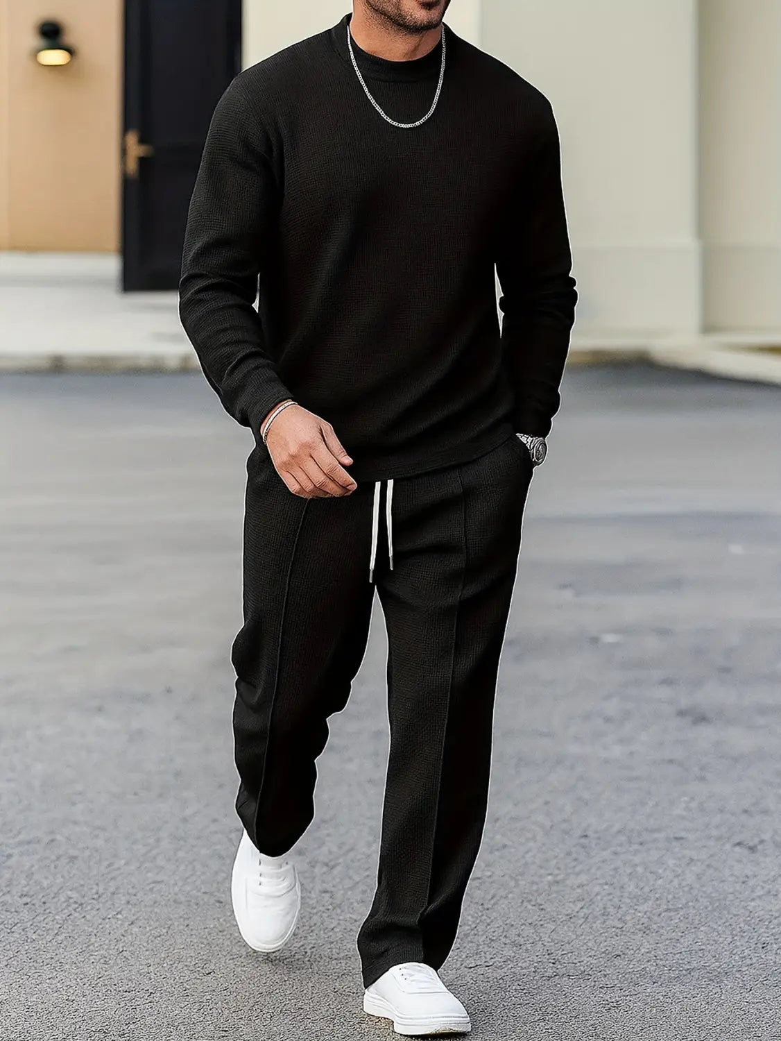 black ribbed knit long-sleeve crew neck sweater from mens minimalist solid color sweatshirt jogger set made of comfortable fabric for casual wear