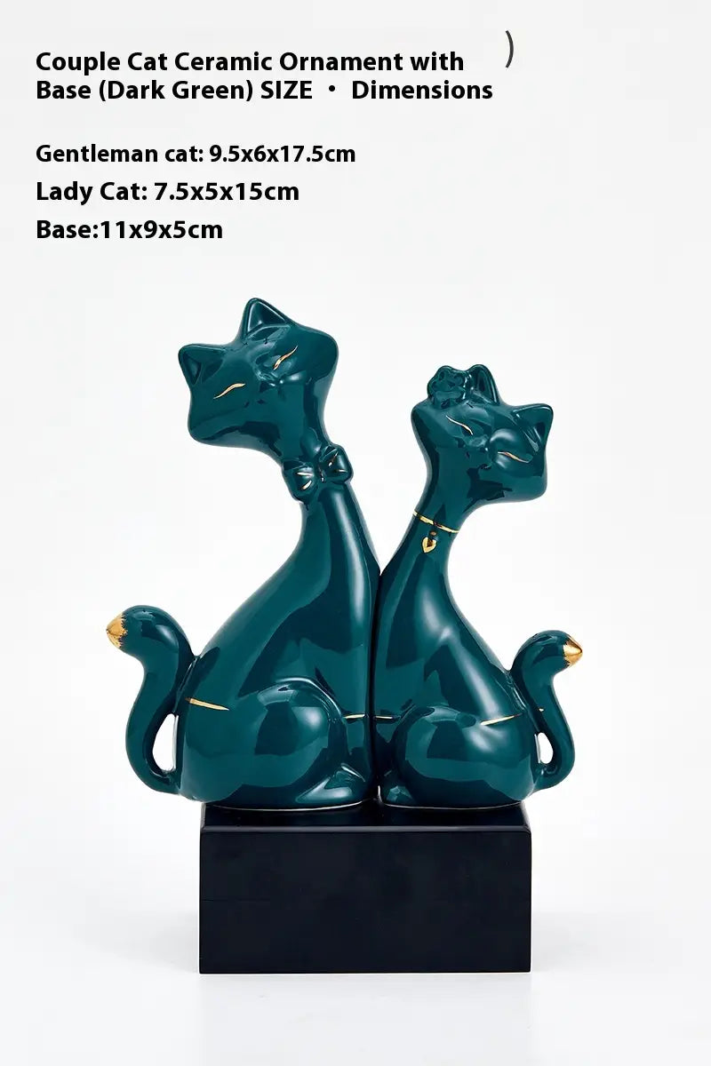 Dark green ceramic couple cat figurines with gold accents on a black base for modern gold and white home decor.