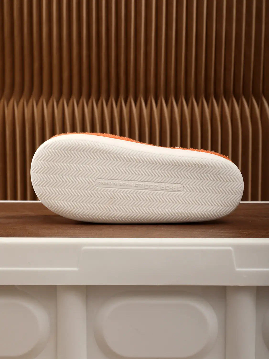 Orange and white plush floral cotton slip-on slippers with soft textured TPR rubber sole.