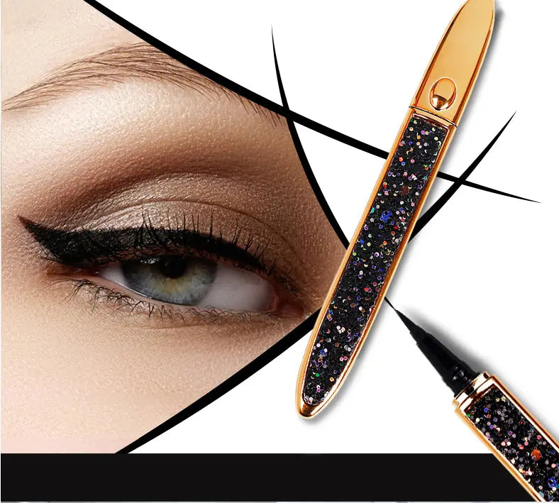 A sleek gold-toned self-adhesive eyeliner pen with a sparkling black glitter body and fine tip designed for precise waterproof application of false lashes.
