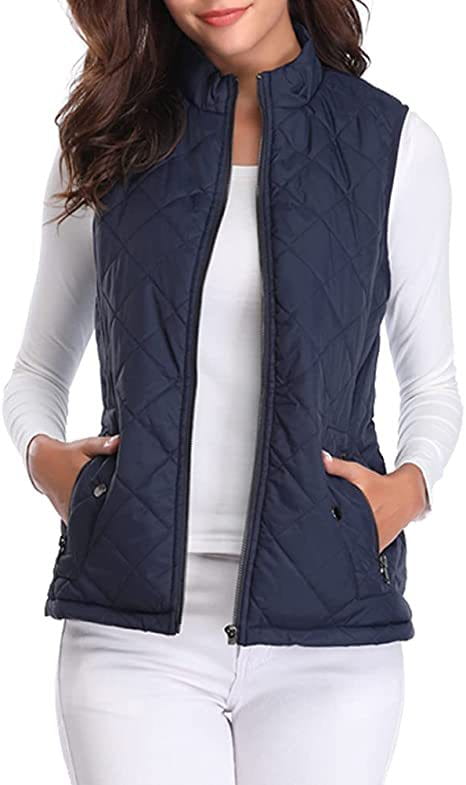 Chaleco acolchado de algodón para mujer azul marino con cremallera frontal de cuello alto y bolsillos laterales.