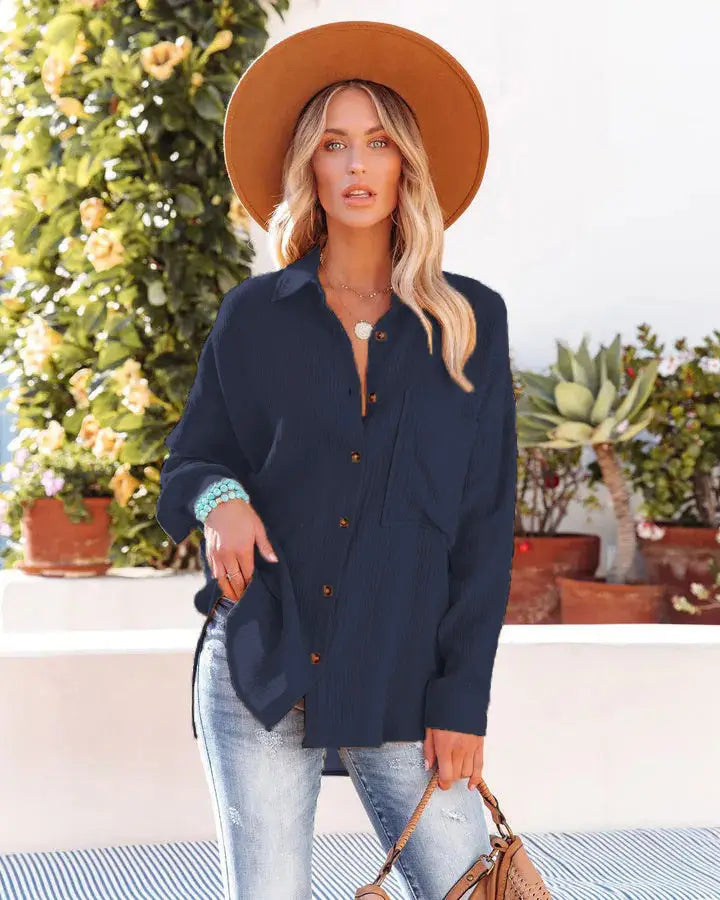 Navy blue women’s relaxed fit button-up shirt with dropped shoulders and a subtle sheen suitable for casual or office wear.