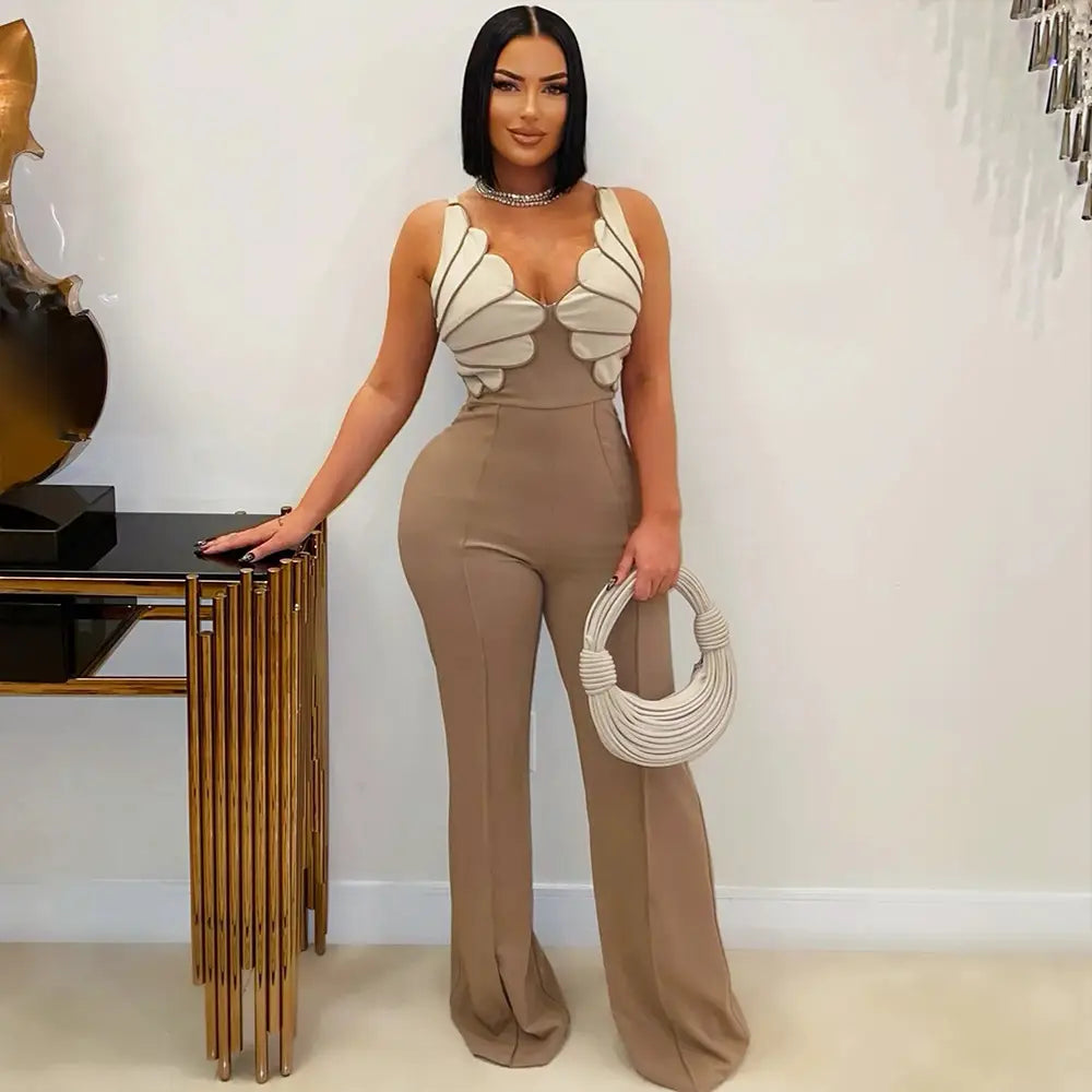 Beige high-waisted jumpsuit featuring white sculptural panel detailing on the bodice in a butterfly wing slim fit design.