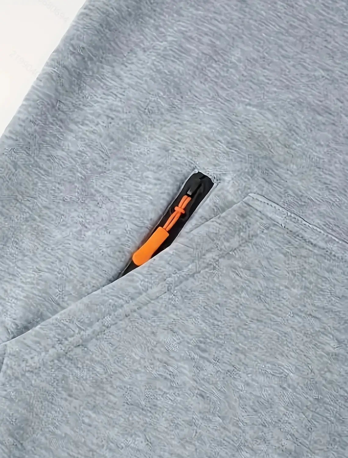 Men’s sport casual fleece lined zipper hoodie jacket in gray heathered fabric featuring a pocket with a black zipper and an orange pull tab.