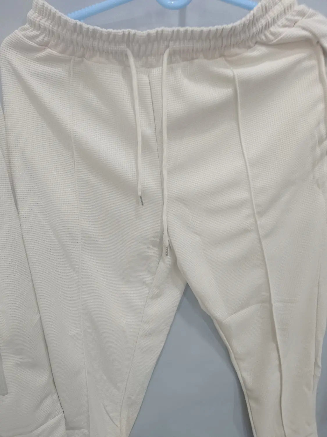 Men slim fit checkered tracksuit featuring cream-colored ribbed knit joggers with an elastic waistband and matching drawstring.