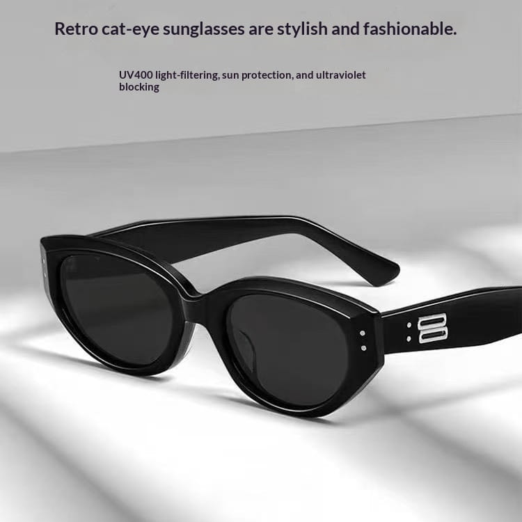 Black retro cat eye uv400 sunglasses with sleek glossy frames and dark lenses for stylish sun protection.