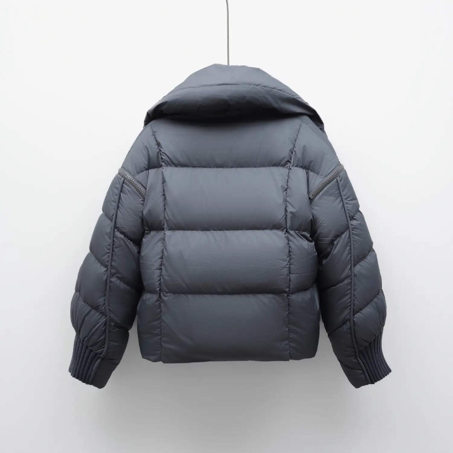Dark gray down jacket patchwork with quilted panels ribbed cuffs and large lapel in Korean style.