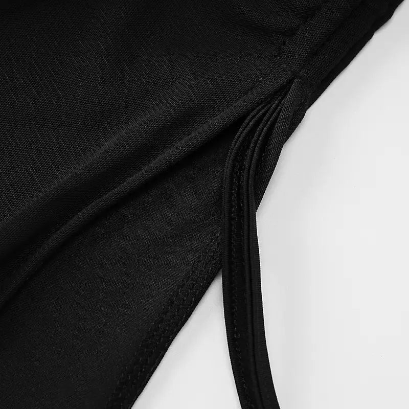 Black fabric y2k ruched strapless side slit mini dress with subtle textured weave, neatly stitched edges, and thin adjustable straps.