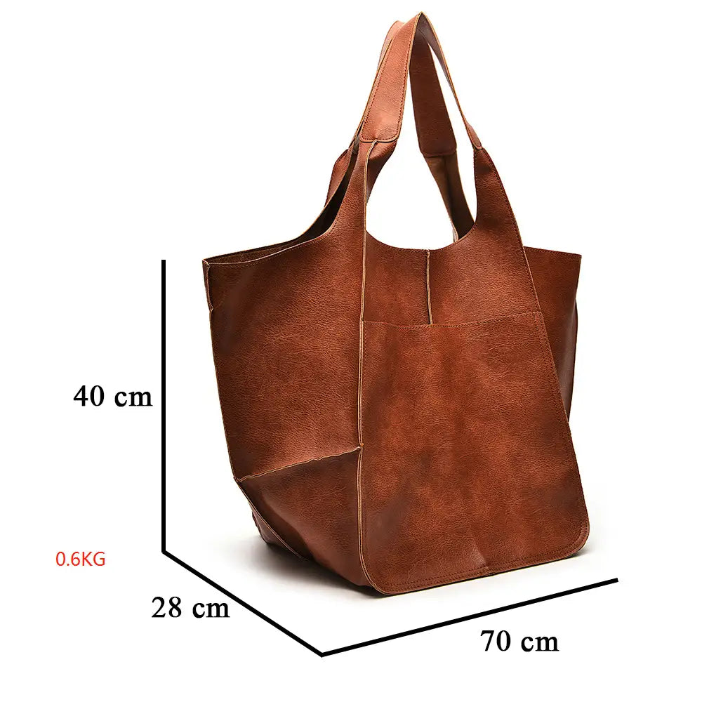 Brown suede-like leather tote bag with large capacity soft slouchy design, two top handles, and front pocket for convenient shoulder use.