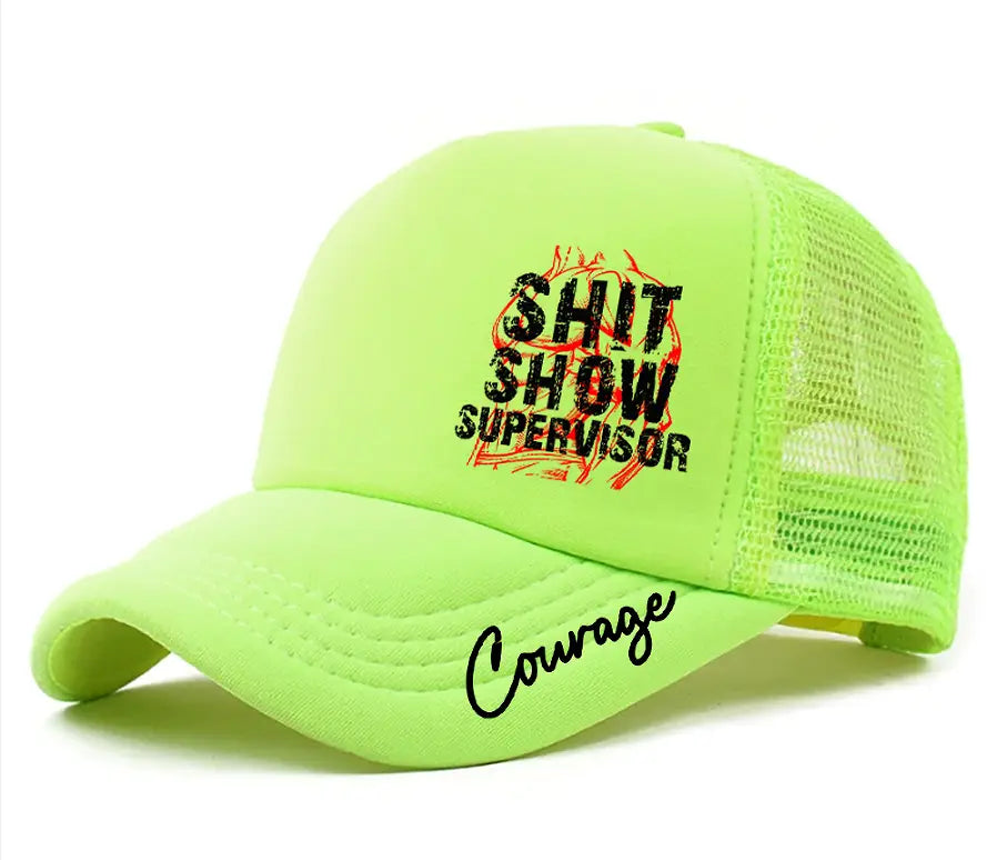 Neon green novelty supervisor trucker hat with black and orange embroidered text reading shit show supervisor and cursive script saying courage along the brim.