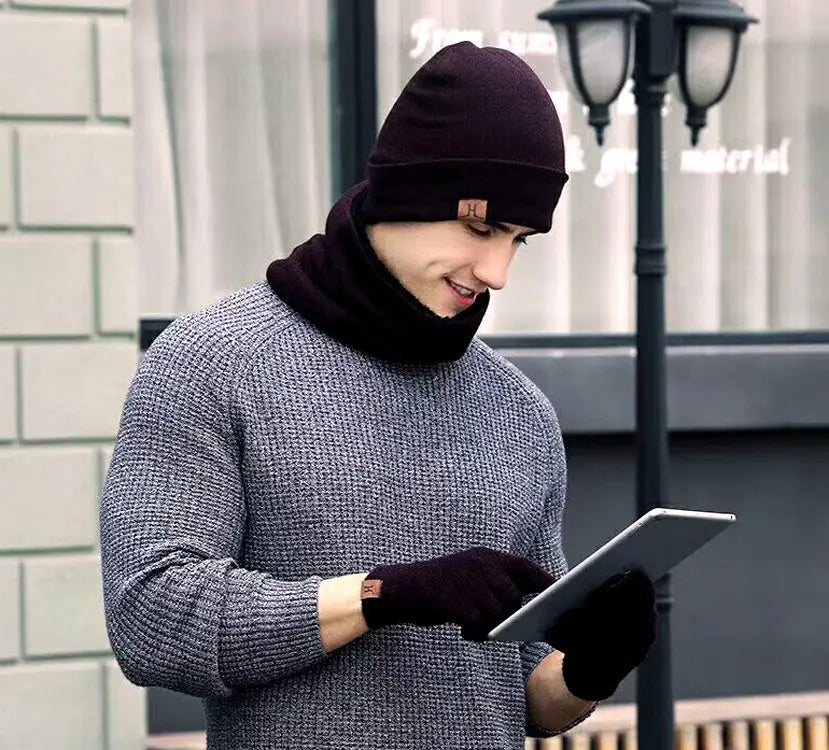Dark brown knit beanie with matching cowl neck scarf featuring a small leather patch on the front as part of a gray knit winter hat scarf and touchscreen gloves set.