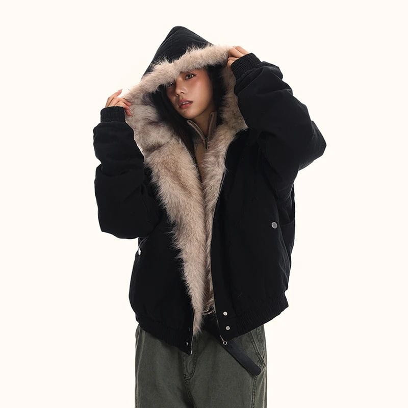 Black puffer jacket with a plush light brown faux fur lined hood designed as a winter bomber jacket.