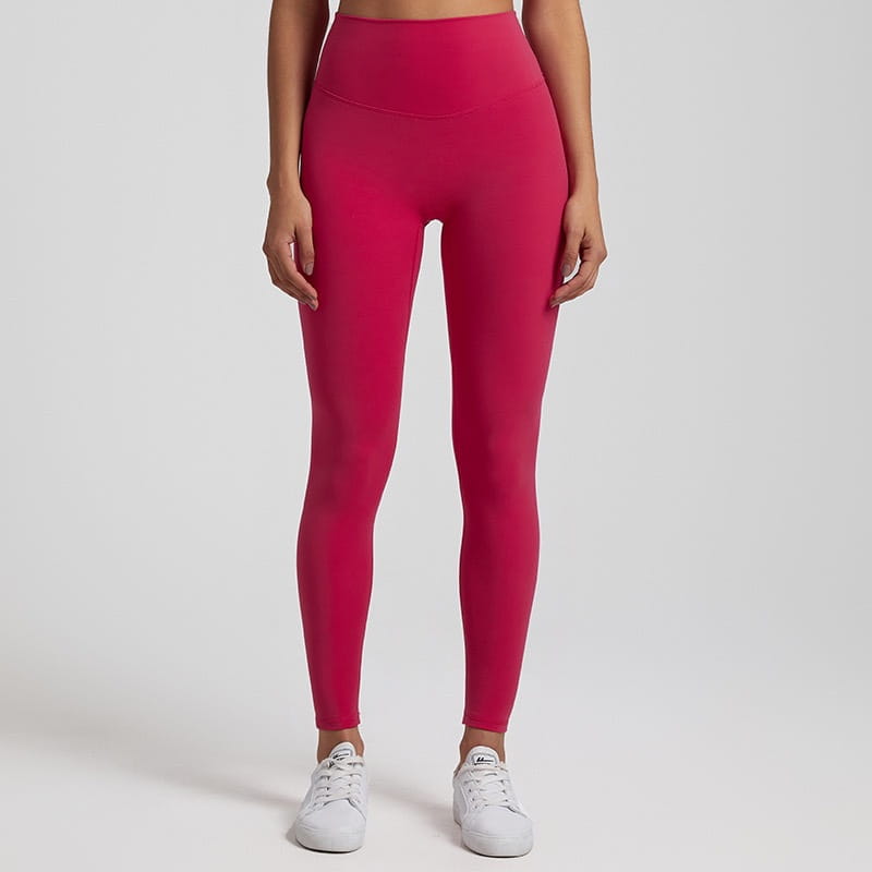 Bright fuchsia high waisted stretch fitted leggings made of form fitting fabric designed for comfort and flexibility.