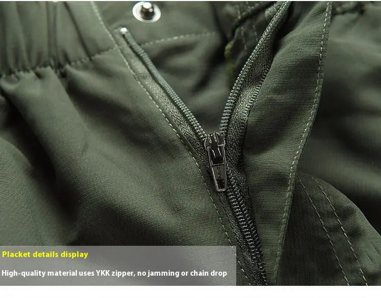 Dark green padded jacket with ykk zipper featuring metallic pull tab and reinforced stitching designed for use with convertible tactical hiking pants.