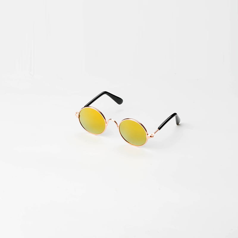 rose gold metal round cat sunglasses with gold-toned frames black temple arms and reflective yellow-green mirrored lenses.