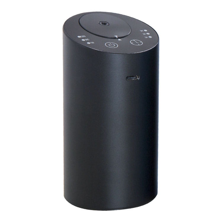 Diffuseur d’arômes portable cylindrique noir, humidificateur de voiture sans fil USB, avec finition mate et boutons de commande sur la partie supérieure.