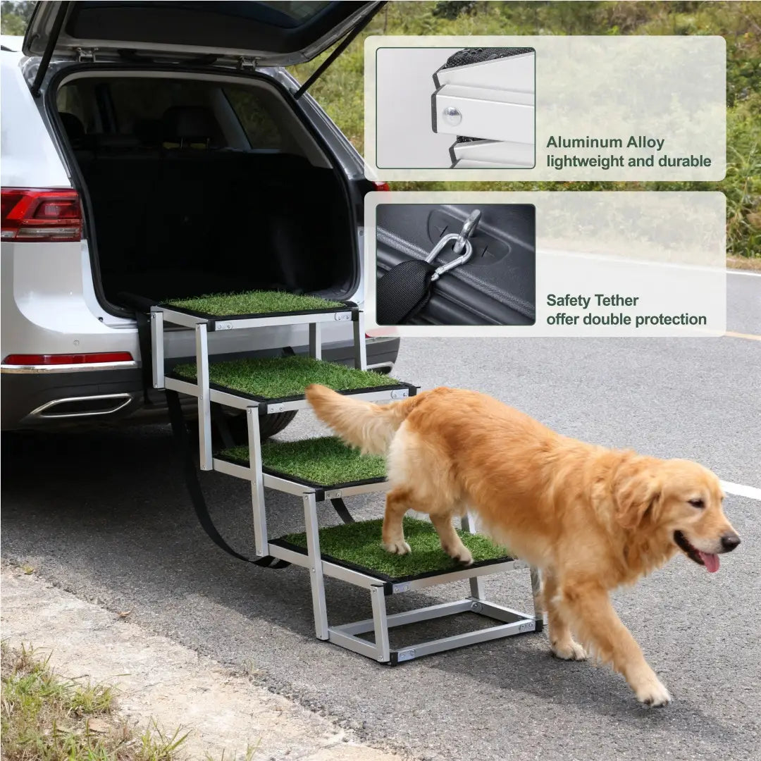 Silver aluminum alloy foldable dog ramp with artificial grass steps and safety tether for cars and SUVs with 250lb capacity.