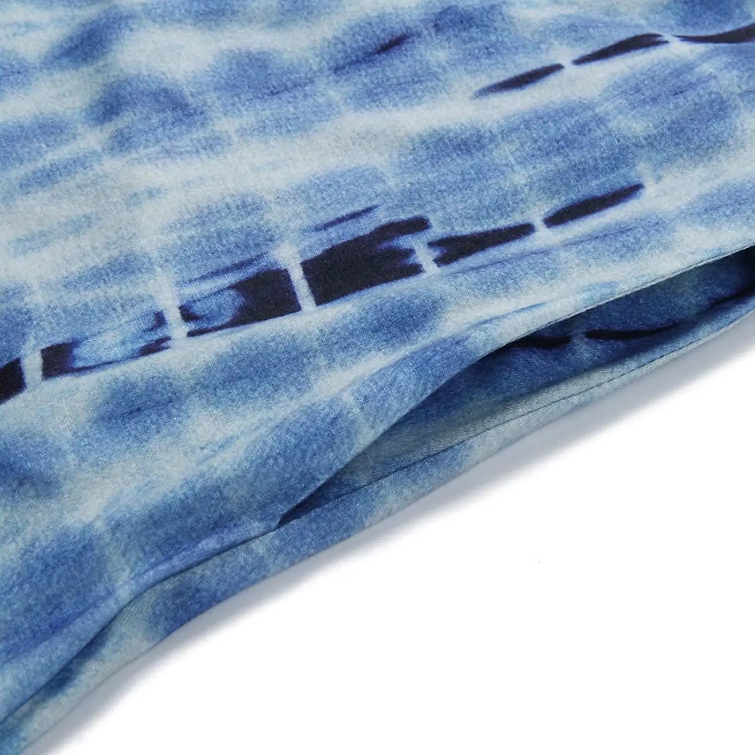 tropical print sleeveless irregular hem maxi dress featuring blue tie-dye fabric with a soft flowing texture and a subtle gradient of light to dark blue hues