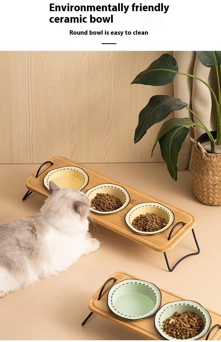 Elevated ceramic cat bowl wooden stand with three ceramic bowls featuring white rims and subtle green or yellow interior glaze.