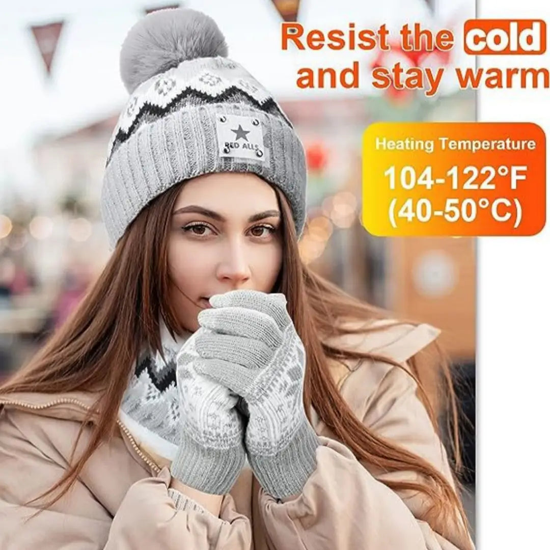 Gray knitted usb heated winter hat with a black-and-white geometric pattern, fluffy pom-pom, and small star emblem on the front.