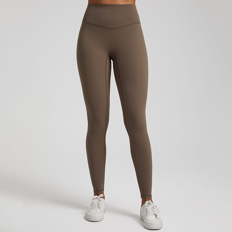 High waisted stretch fitted leggings in taupe made of stretchy form fitting fabric.