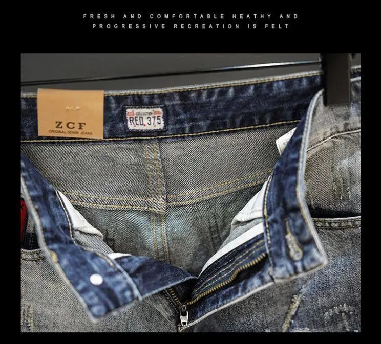 A pair of distressed maple leaf denim shorts in dark-wash denim with a faded look and visible stitching details.