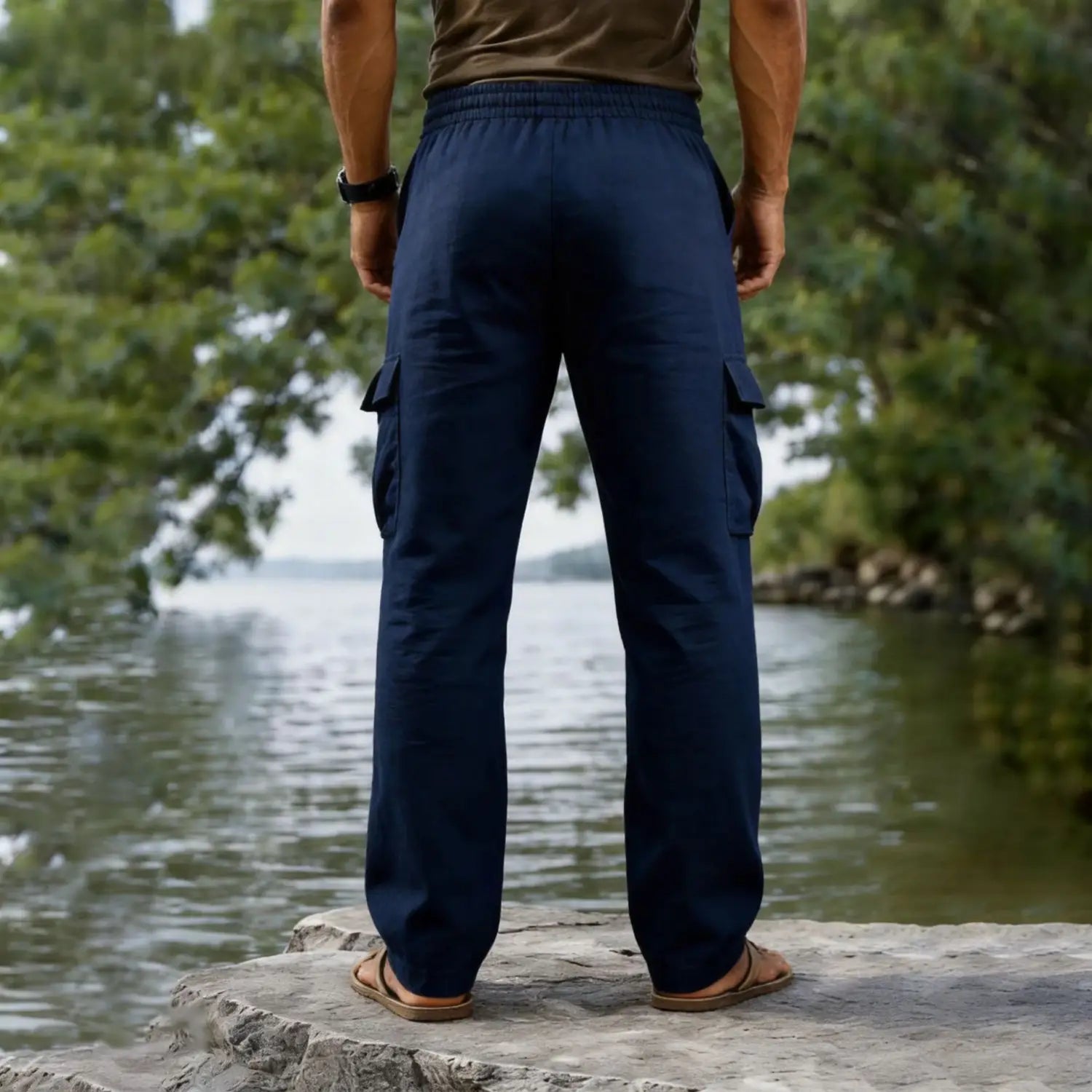 navy blue men cotton linen cargo pants with elastic waistband and multiple side pockets designed for casual wear with a straight leg and drawstring closure