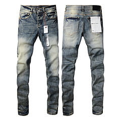 Men’s distressed slim fit patchwork denim jeans in blue with a faded wash and durable material.