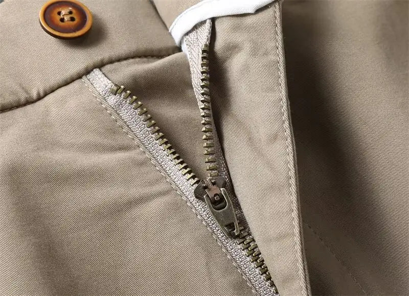 Beige cotton men casual slim fit cargo shorts featuring a metallic zipper and a wooden button.