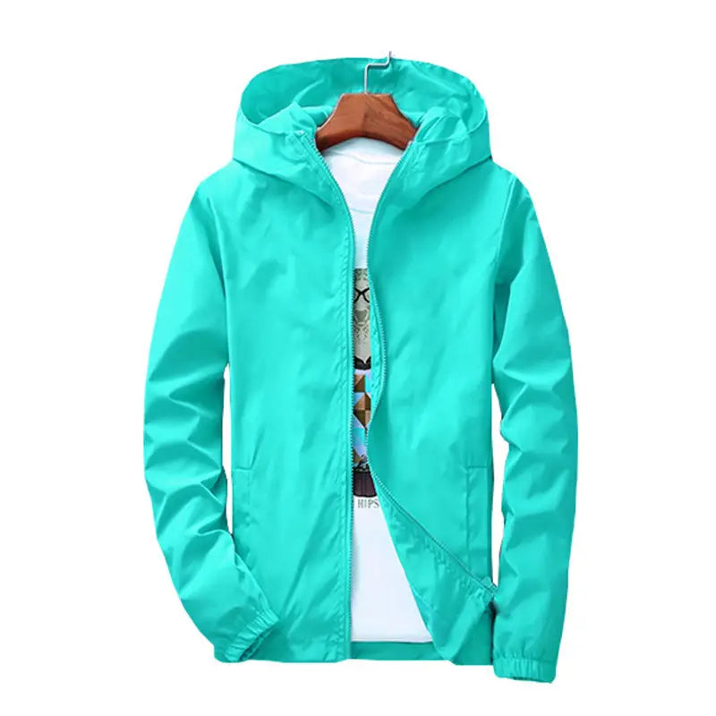 A vibrant turquoise casual hooded zipper jacket for men and women with a full-length zipper and elastic cuffs displayed on a wooden hanger.