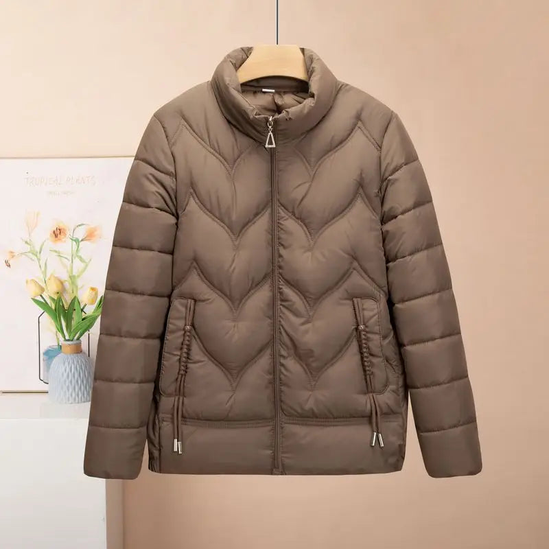 A stylish olive green quilted puffer jacket for women featuring a high collar and chevron stitching pattern ideal for winter wear.