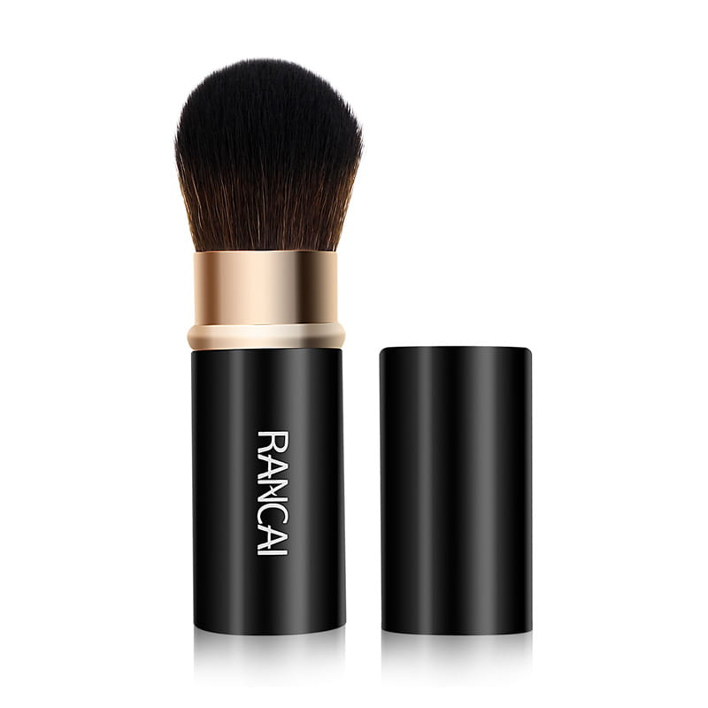 Black rancai retractable makeup brush mini with gold-toned band and dense dark bristles for precise application