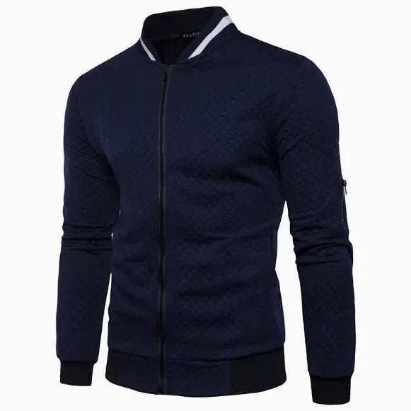 Men’s navy blue quilted colorblock bomber jacket featuring textured fabric and white and black contrast trim on the stand collar.